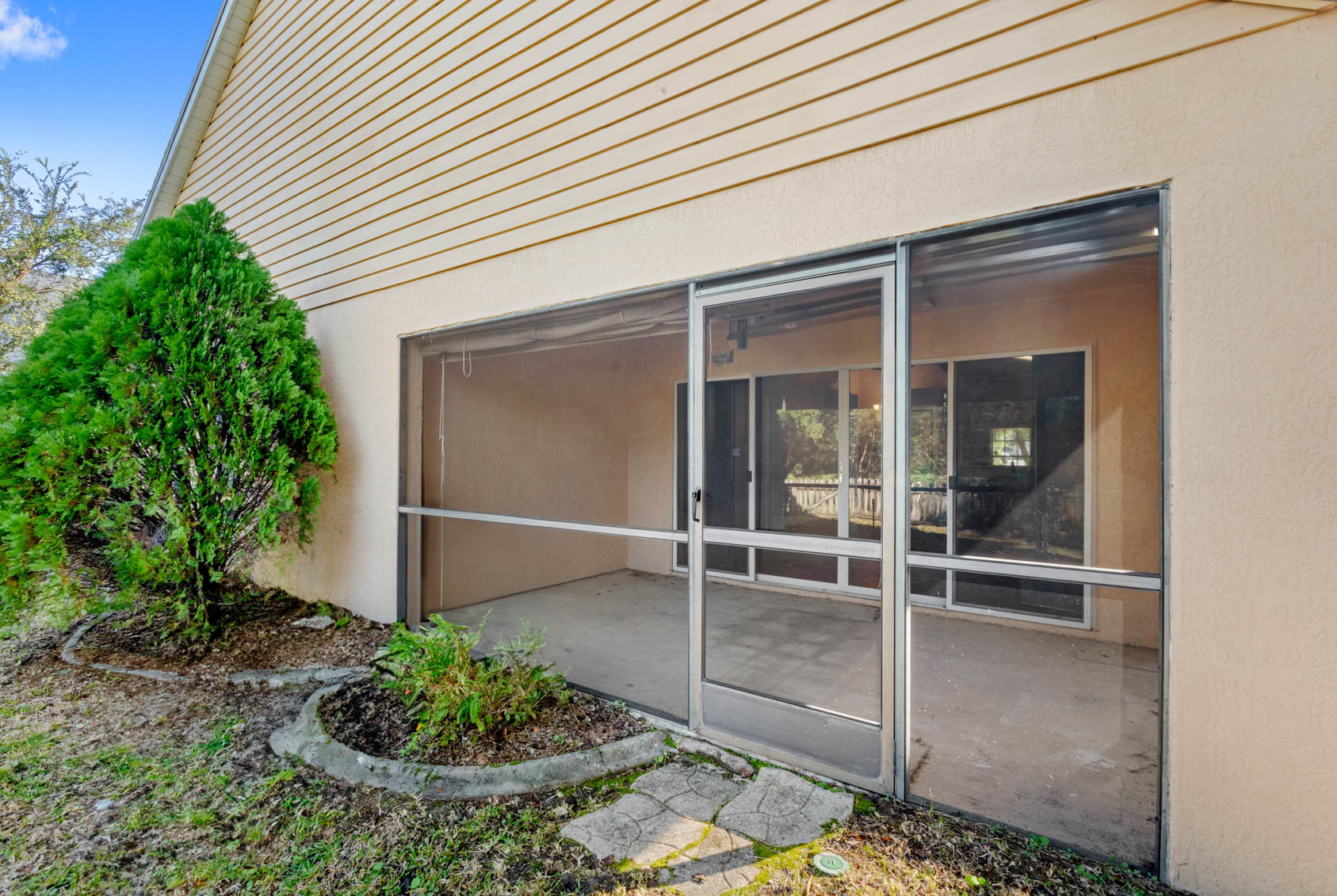 back patio with enclosed screen